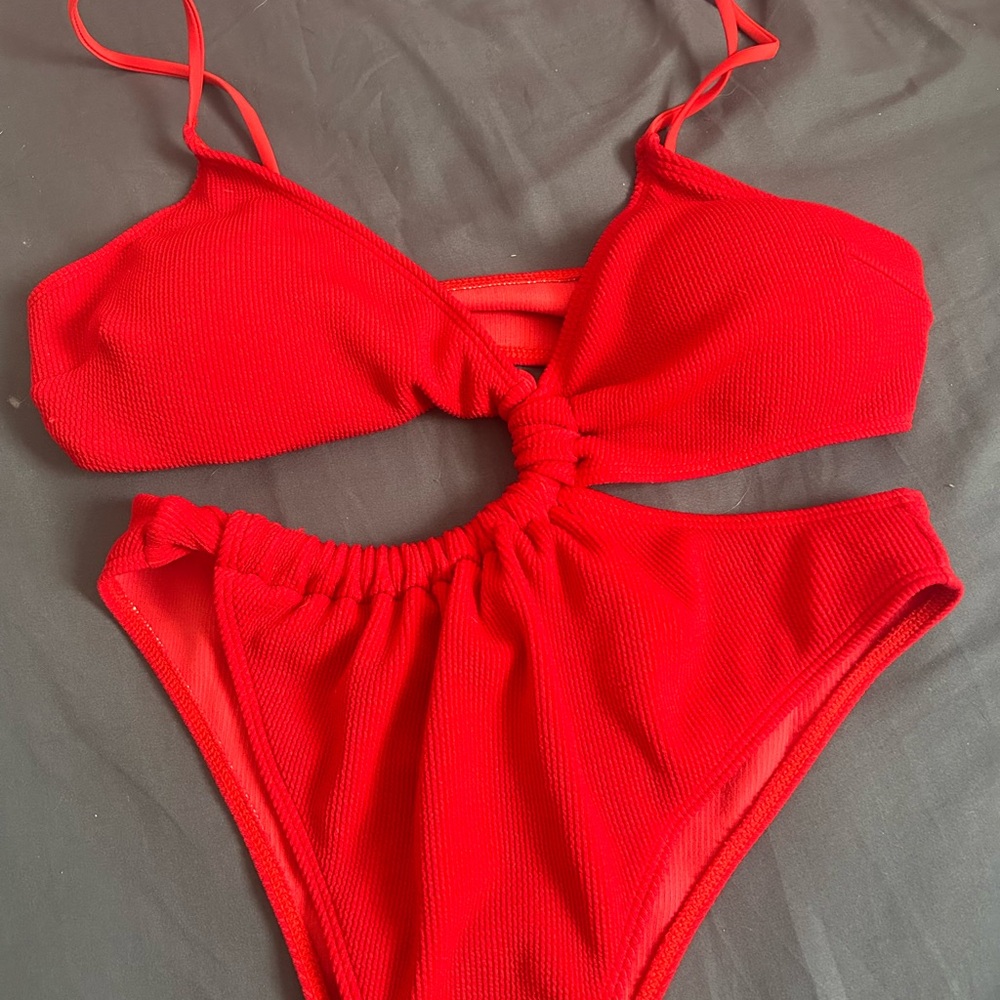 The Swimsuit with Cutout new never worn